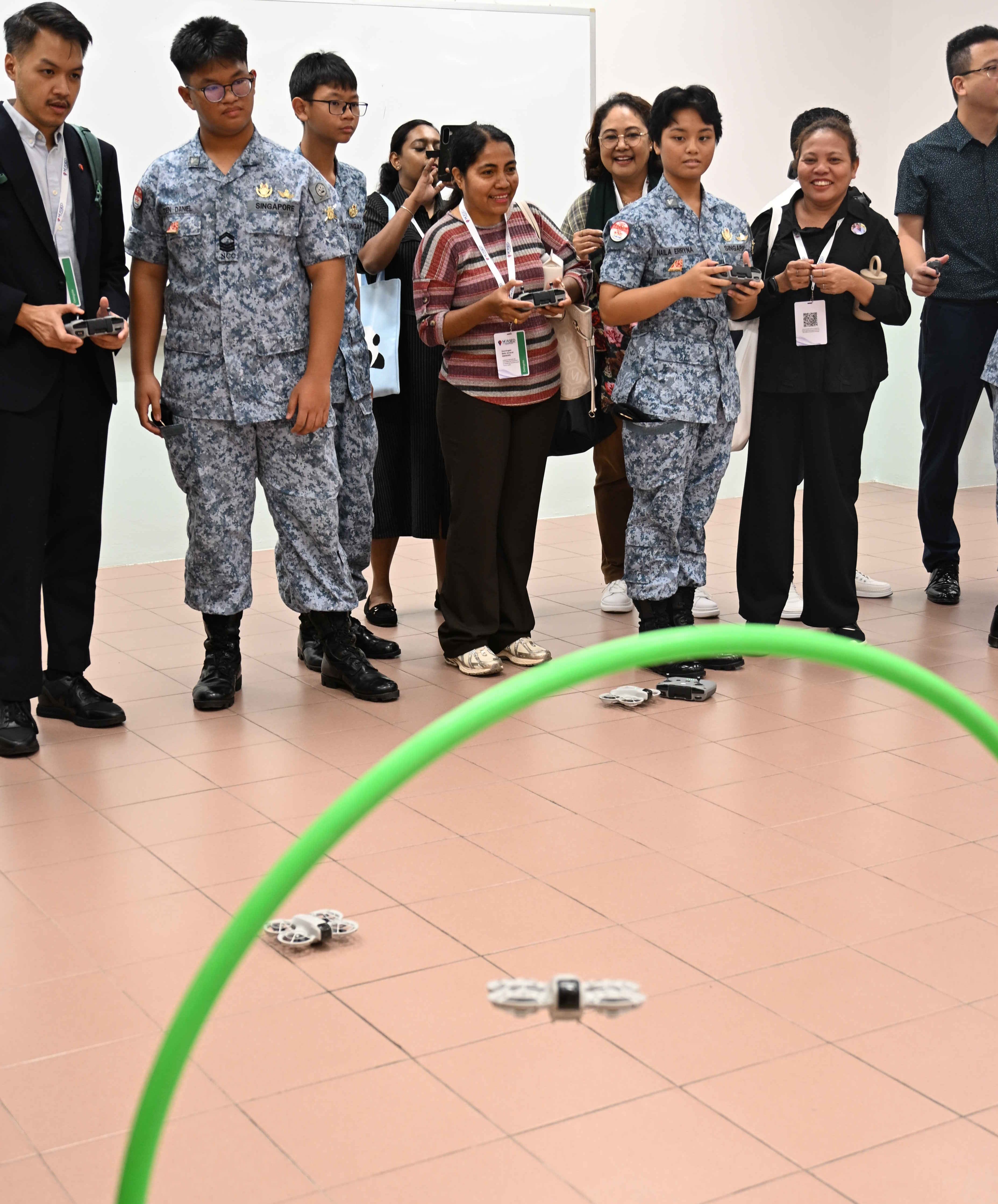 Showing the delegates how to fly the drone.
